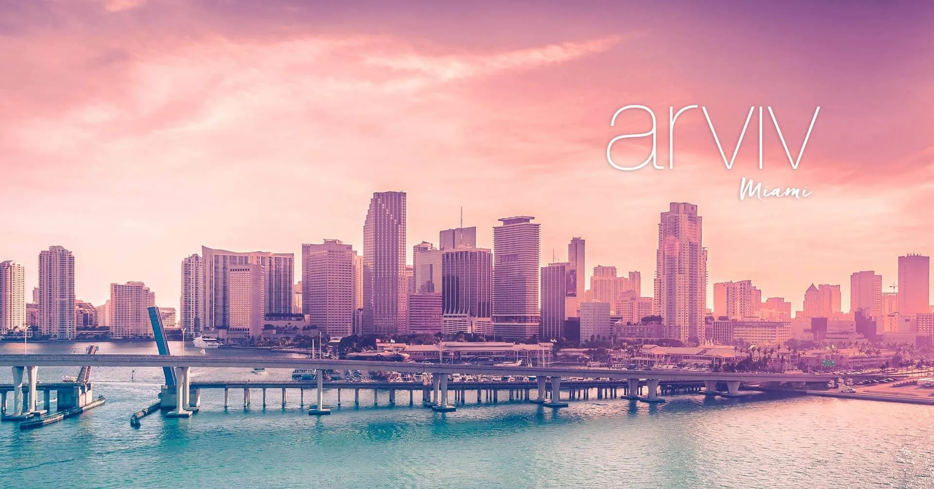 The downtown Miami skyline at sunset, carrying the Arviv Medical Aesthetics Miami wordmark