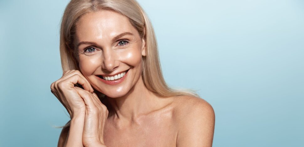 Elegant,Middle,Aged,Woman,,Head,And,Shoulders,With,Glowing,Skin,